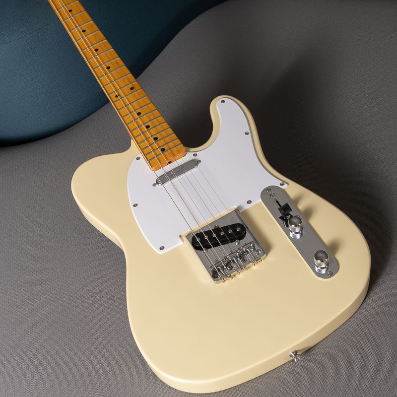 aged vintage white guitar